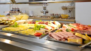A buffet with various food items including cheeses, meats, and fruits. - ARIBO Hotel Erbendorf (Erbendorf)