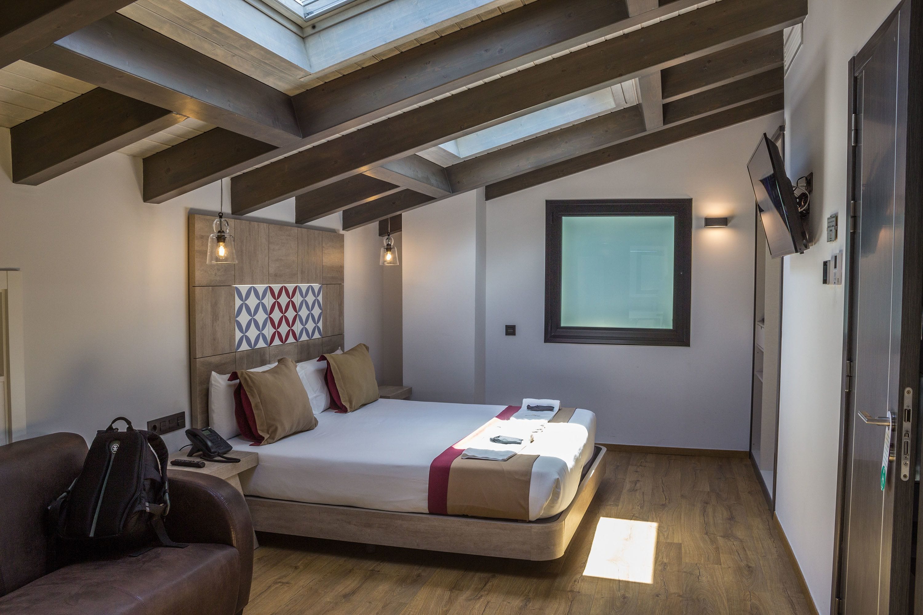 deluxe double room, hot tub | in-room safe, desk, laptop workspace, blackout curtains