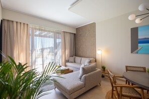 One Bedroom Suite Private Pool | Living room | 40-inch flat-screen TV with satellite channels, TV - Miraggio Thermal Spa Resort (Kassandra)