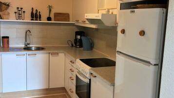 Apartment, 1 Bedroom, Patio (Gæstgiverstien) | Private kitchen | Fridge, oven, cookware/dishes/utensils