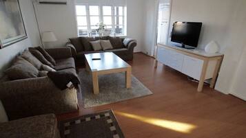 Apartment, 2 Bedrooms, Patio (Gæstgiverstien) | Living area | 32-inch flat-screen TV with cable channels, TV