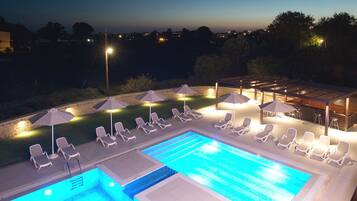 Seasonal outdoor pool, pool umbrellas, pool loungers