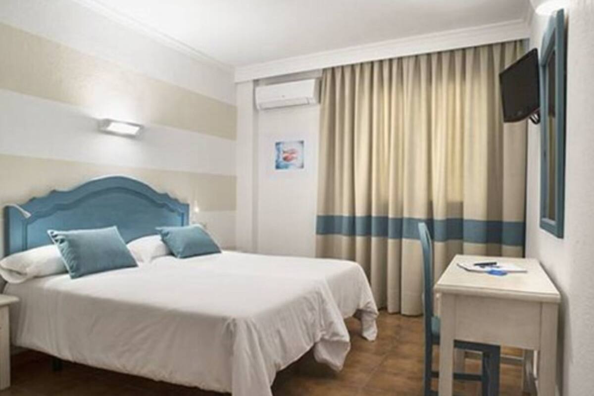 Desk, laptop workspace, free WiFi, bed sheets