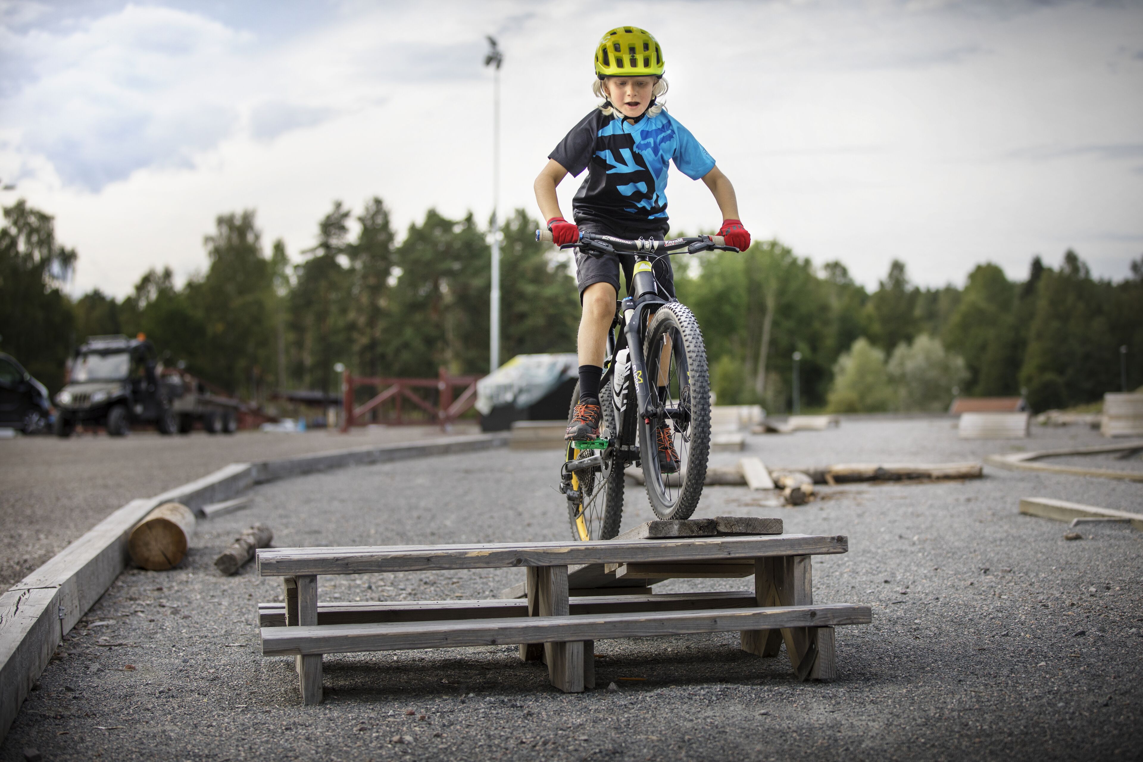 A person riding a bicycle on a wooden ramp.