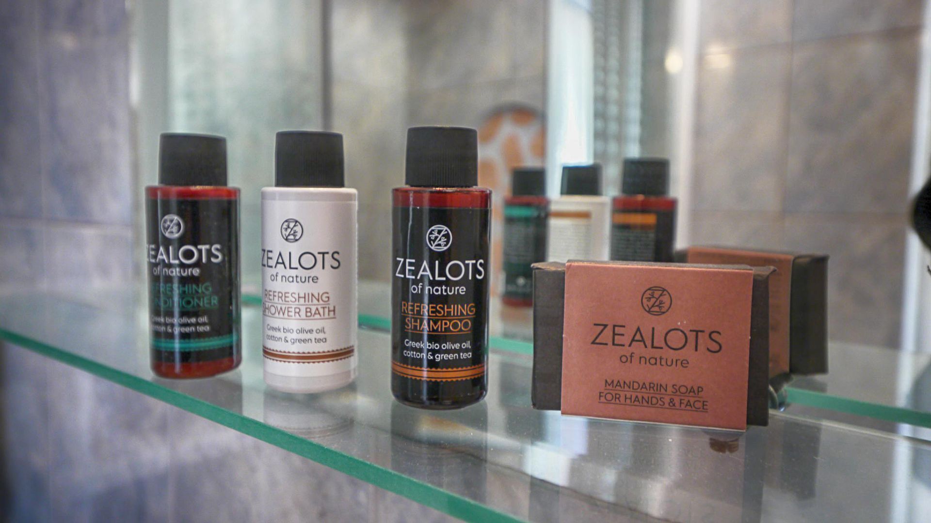 A display of Zealots of Nature products including a refreshing shower bath, refreshing shampoo, and mandarin soap for hands and face.