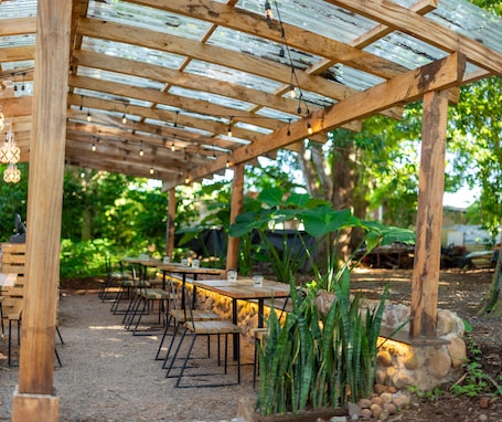 Breakfast, lunch, dinner served; local cuisine, garden views