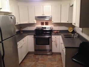 Cottage, 2 Bedrooms, Hot Tub (RV on-site with additional beds) | Private kitchen | Fridge, microwave, oven, stovetop - Pointe-du-Chêne Executive (Pointe-du-Chene)