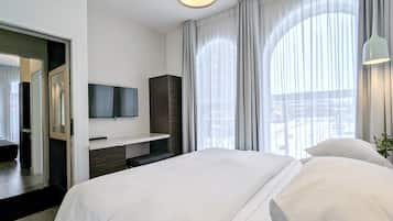 シティ スイート クイーンベッド 1 台ソファーベッド付き 簡易キッチン コーナー | 1 室のベッドルーム、低刺激性寝具、セーフティボックス (室内)、防音設備