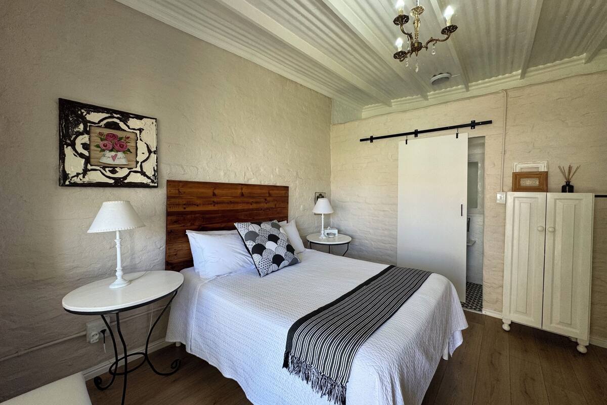 Hummingbird Room | Premium bedding, desk, laptop workspace, iron/ironing board