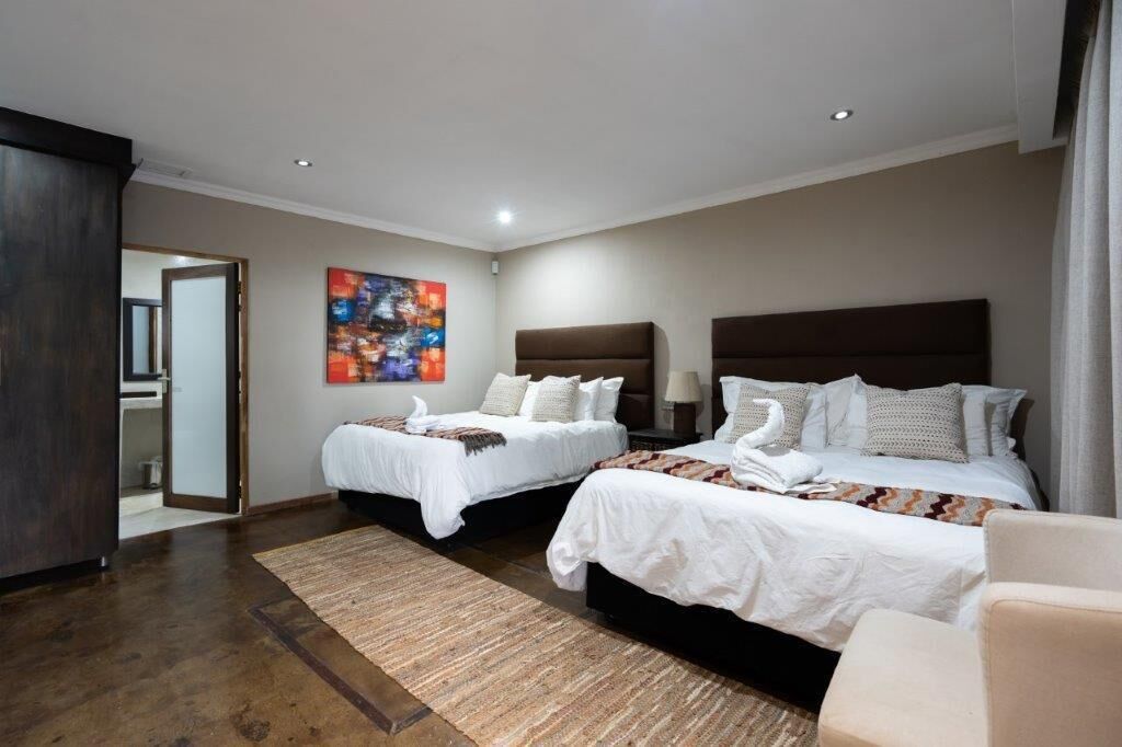 Habitación Deluxe | Decoración individual y ropa de cama