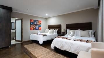 Habitación Deluxe | Decoración individual y ropa de cama