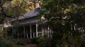 A house with a covered porch, surrounded by dense trees. - Brooklyn Farm Bed and Breakfast (Myponga Beach)