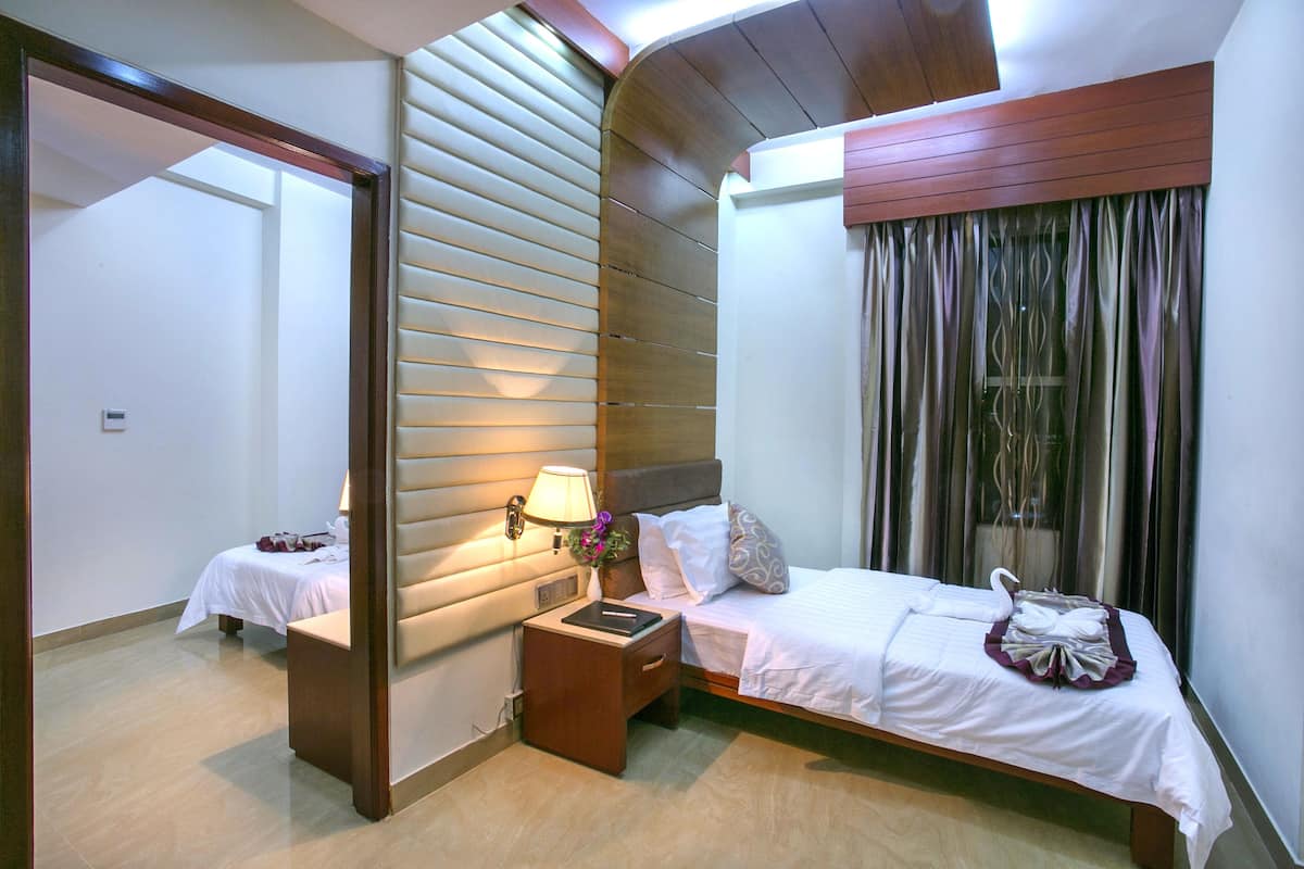 Family Suite, 2 Bedrooms, Corner | Down comforters, minibar, in-room safe, desk