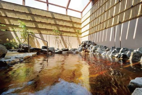 Outdoor spa tub. Hotel Route-Inn Grand Ueda Ekimae