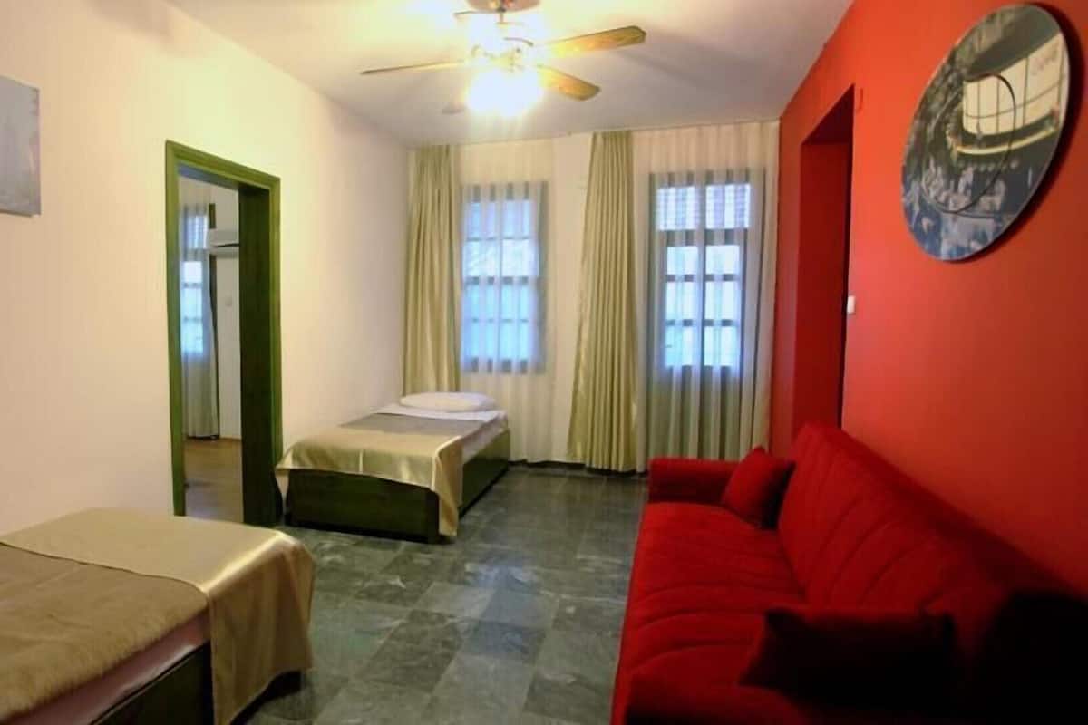 Family Room | Free minibar items, in-room safe, desk, blackout drapes