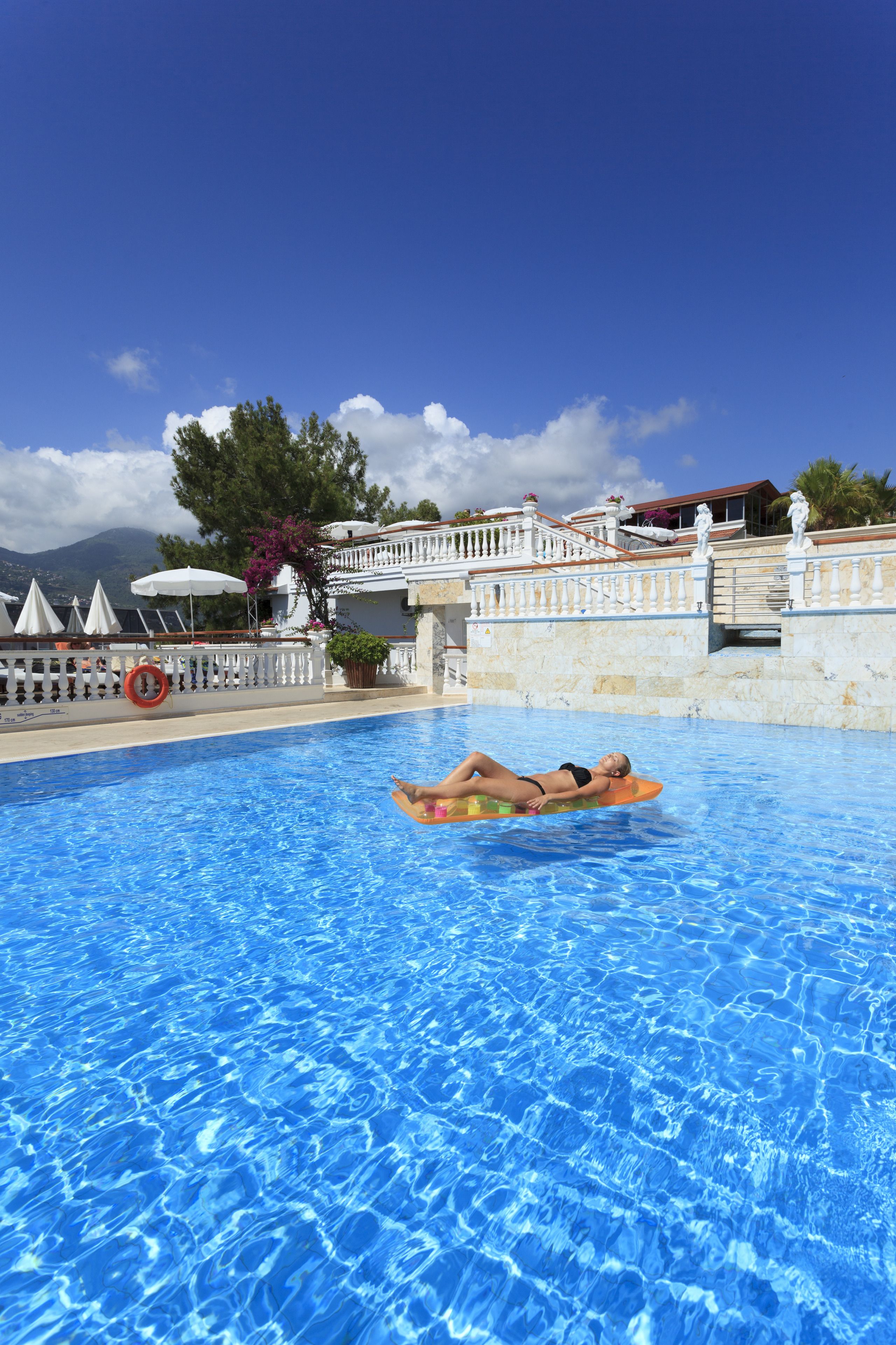 2 outdoor pools, open 9:00 am to 7:00 pm, pool umbrellas, pool loungers