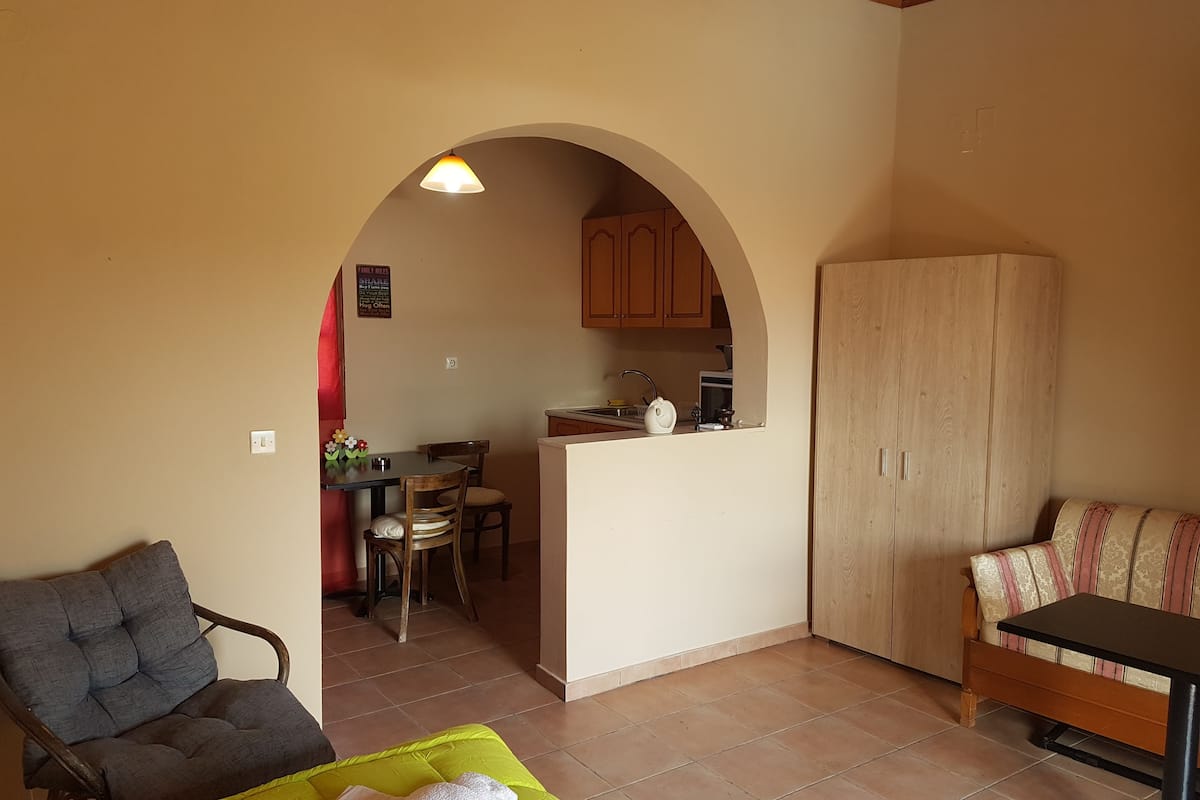 deluxe apartment, 1 bedroom | living area | flat-screen tv