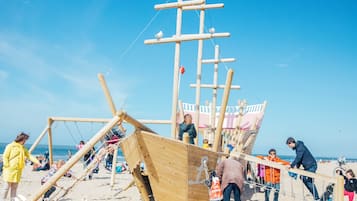 Kids can climb and play on the multi-level structure overlooking the ocean.