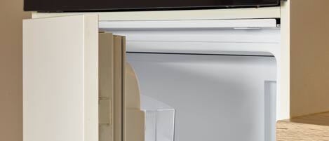 An open refrigerator with a handle, a Bosch logo, and transparent shelves.