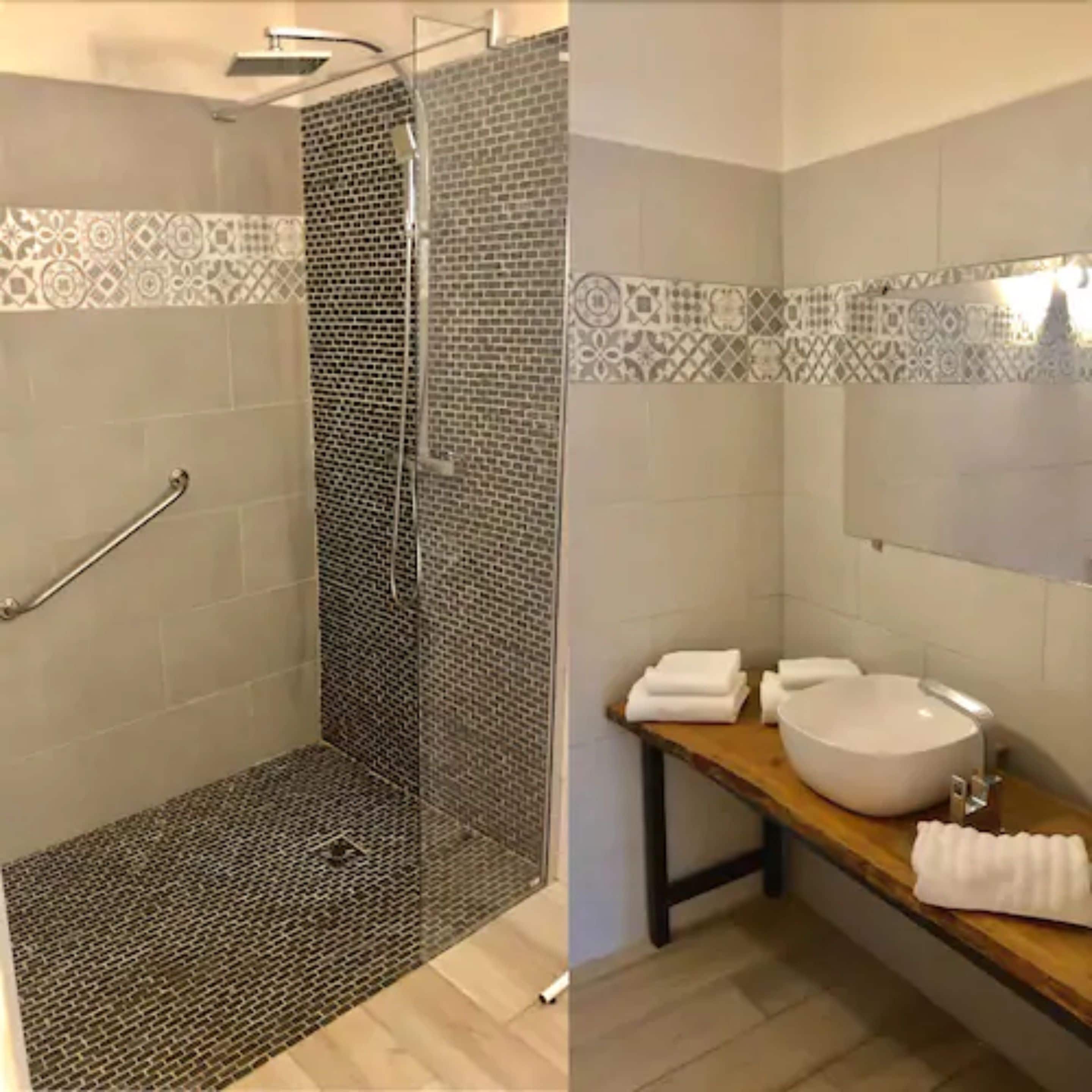 superior double room | bathroom | rainfall showerhead, free toiletries, hair dryer, towels