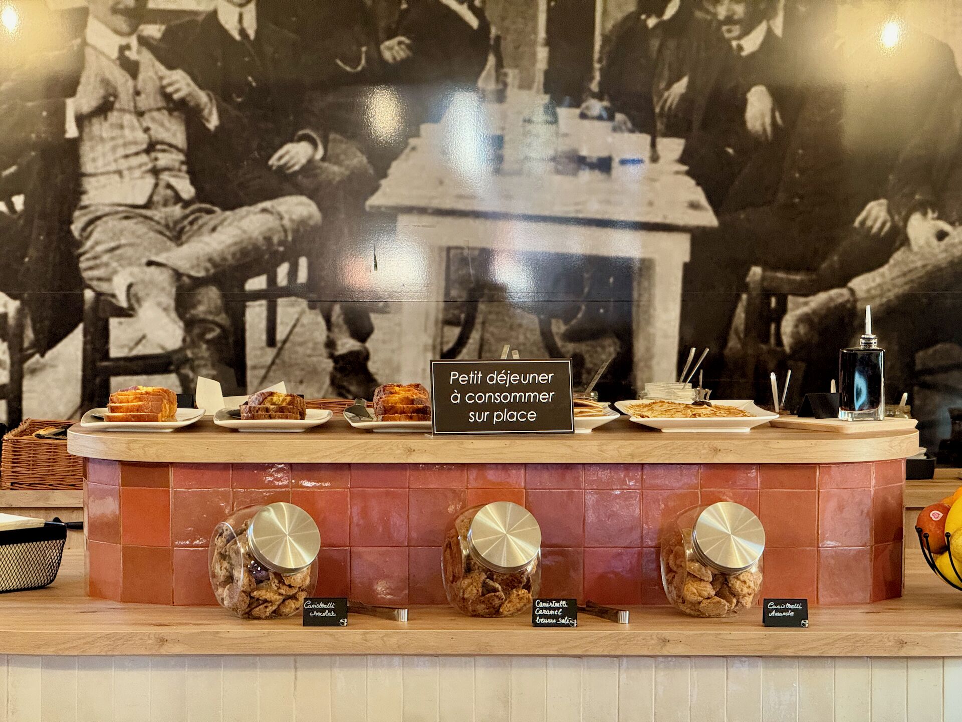 A buffet counter with various food items and a sign indicating it is for consumption on the premises.