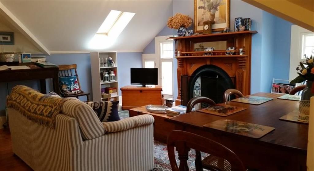 The Attic | Living room | 28-inch flat-screen TV with premium TV channels, TV, DVD player