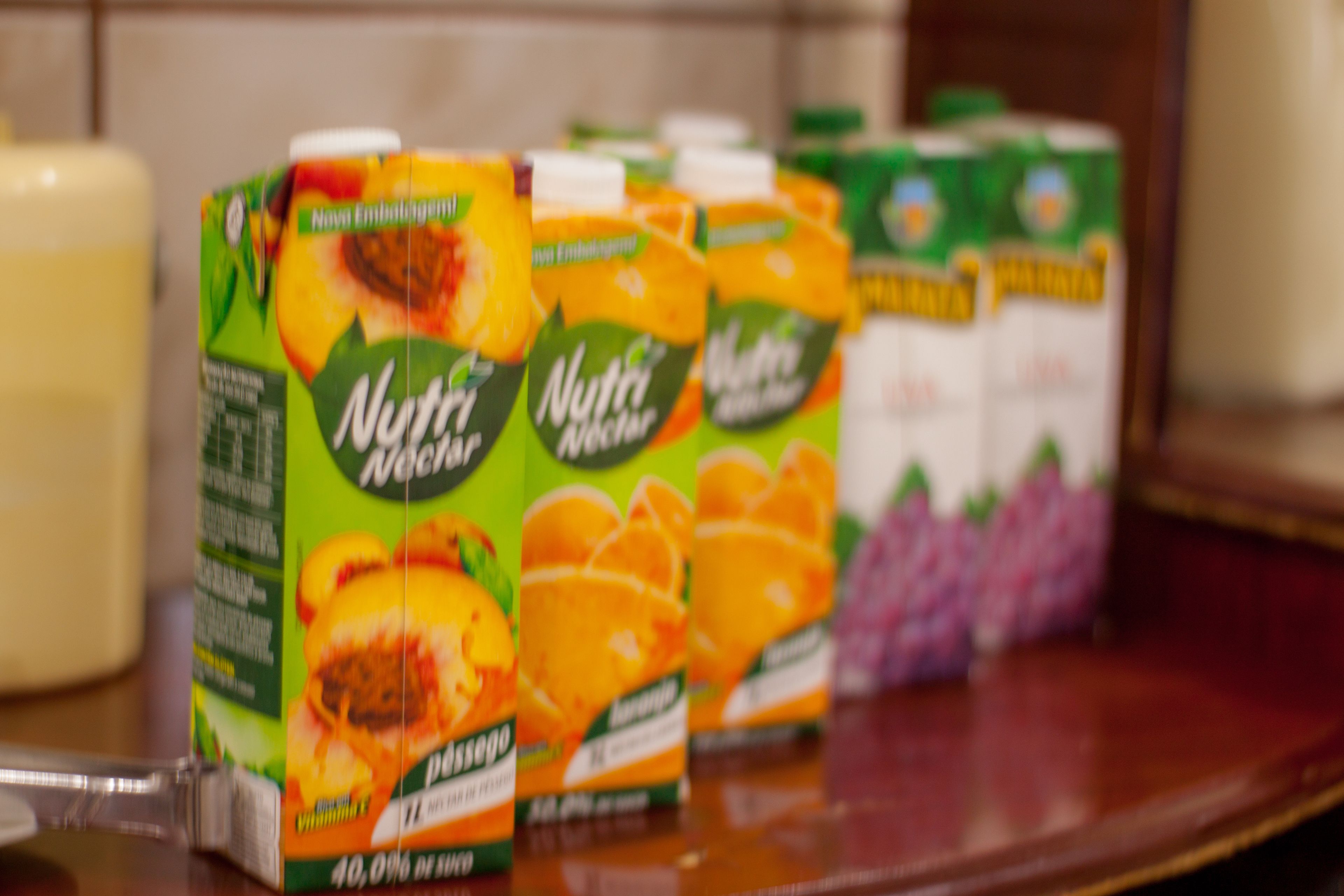 A row of Nuttli juice cartons on a shelf.