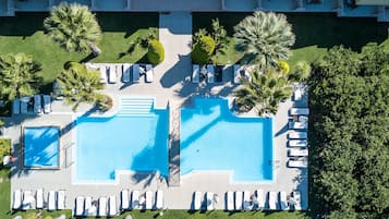 Seasonal outdoor pool, open 9 AM to 7 PM, pool umbrellas, pool loungers