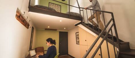 A two-story apartment with a staircase connecting the floors.