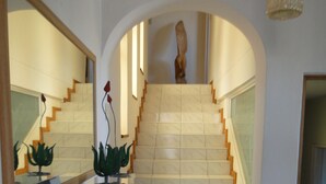 A staircase with a handrail, leading to an upper floor. - Bluewater Beach Accommodation (Gqeberha (Port Elizabeth))
