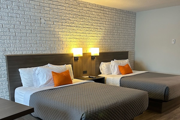 Signature Quadruple Room, 2 Queen Beds, Private Bathroom | Desk, soundproofing, iron/ironing board, rollaway beds