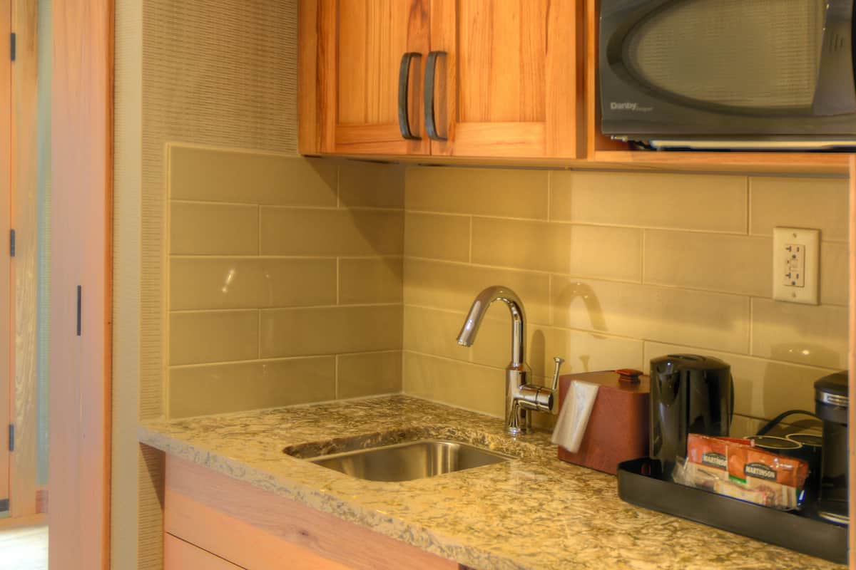 superior one bedroom suite 1 king | premium bedding, in-room safe, blackout curtains, iron/ironing board