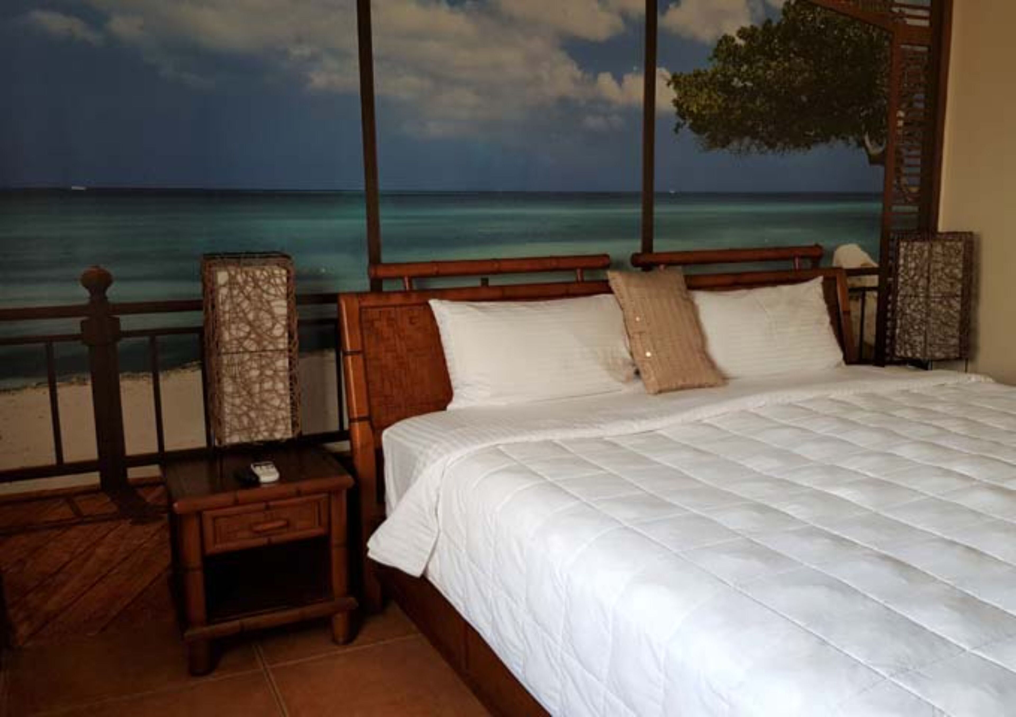deluxe double room, balcony, ocean view | in-room safe, desk, laptop workspace, iron/ironing board