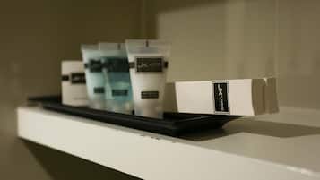 A shelf with skincare products and a box labeled "JKL".