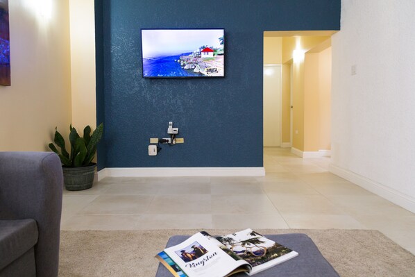 Luxury Apartment, 2 Bedrooms, City View, Executive Level | Living area | 50-inch flat-screen TV with cable channels, TV, DVD player - New Kingston Guest Apartment at Westbury (Kingston)