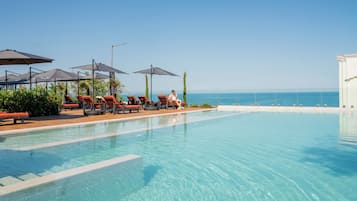Seasonal outdoor pool, open 8:00 AM to 6:00 PM, free cabanas