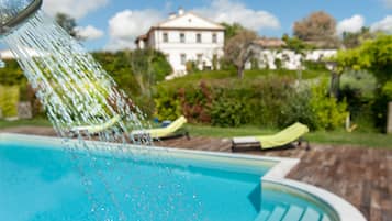 Seasonal outdoor pool, open 8:00 AM to 6:00 PM, pool umbrellas