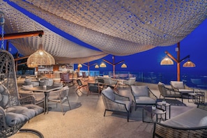2 bars/lounges, poolside bar, beach bar