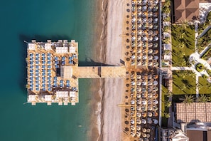 Private beach, sun loungers, beach umbrellas, beach volleyball