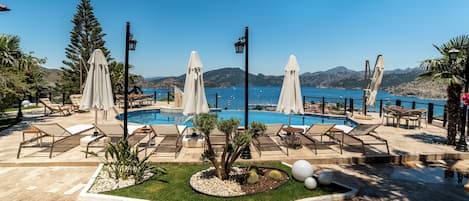 Outdoor pool, pool umbrellas, pool loungers