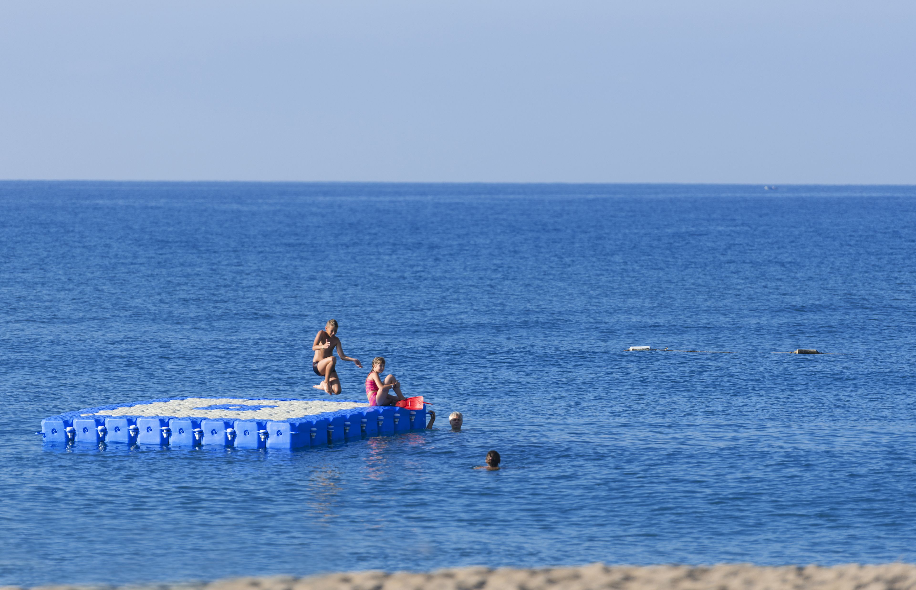 private beach, sun-loungers, beach umbrellas
