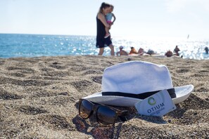 Private beach, sun-loungers, beach umbrellas, windsurfing