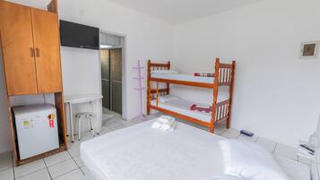 Standard Quadruple Room | Minibar, desk, laptop workspace, blackout drapes