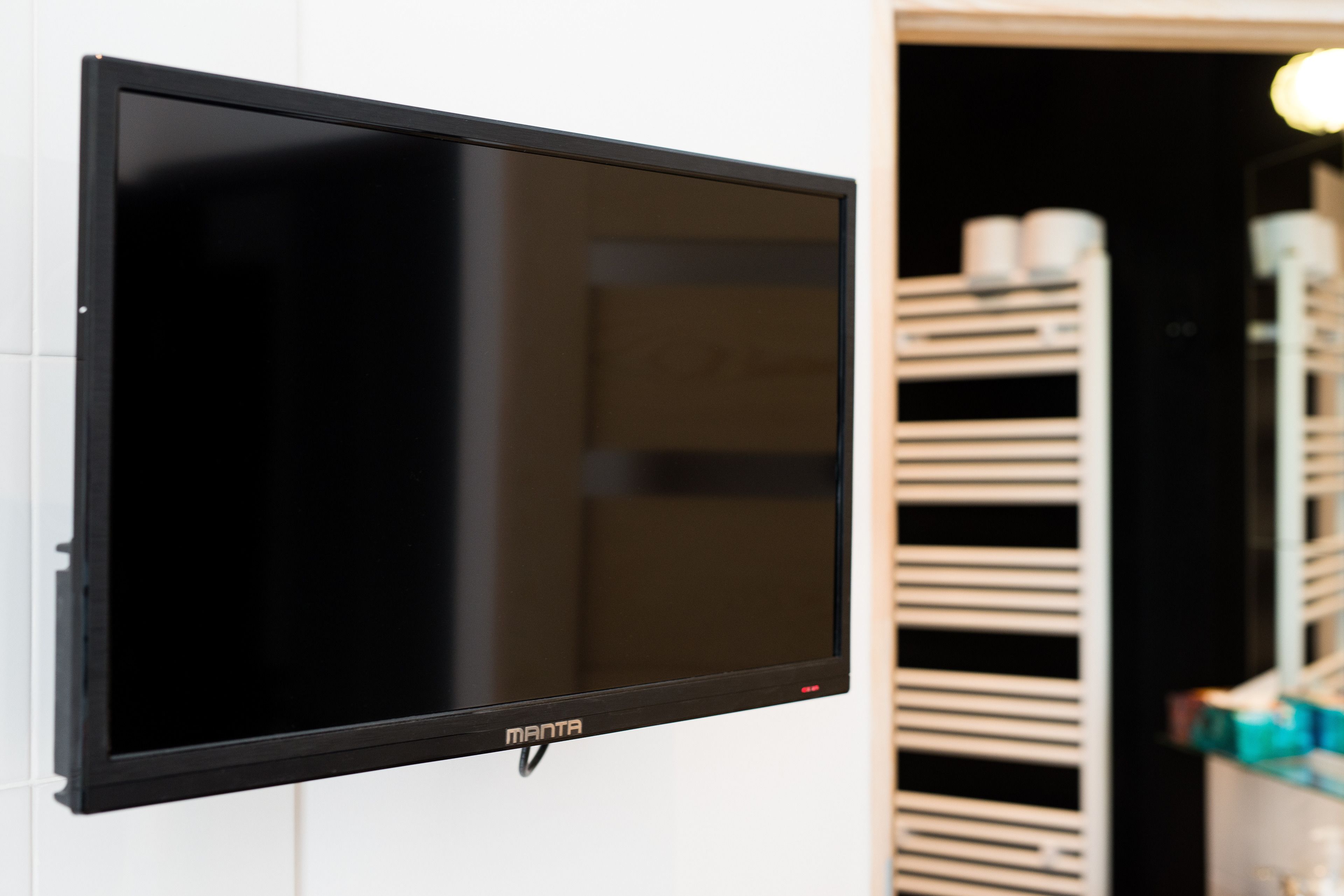 A flat-screen TV mounted on a wall.