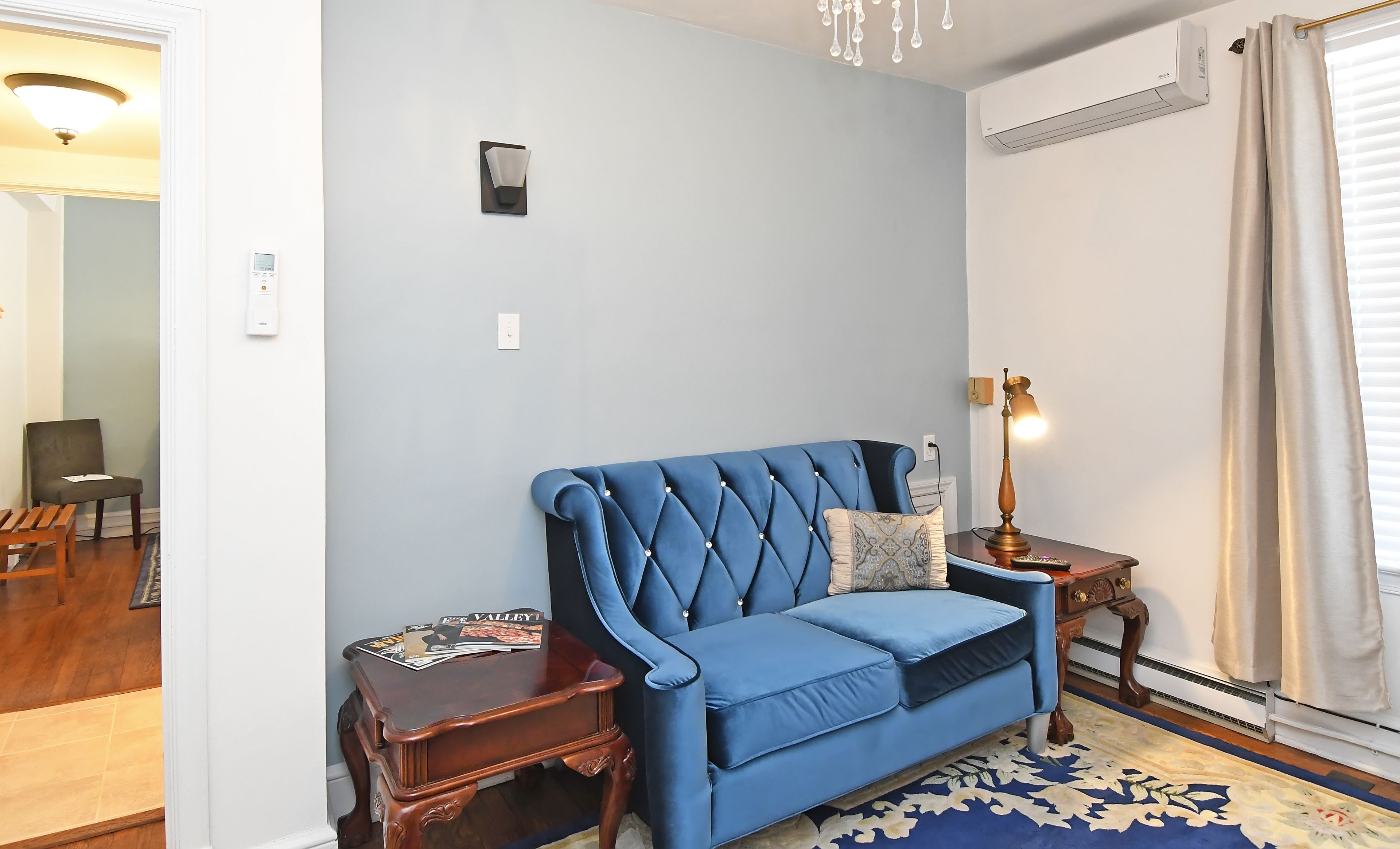 deluxe suite, 1 queen bed (historic inn ) | living area | flat-screen tv