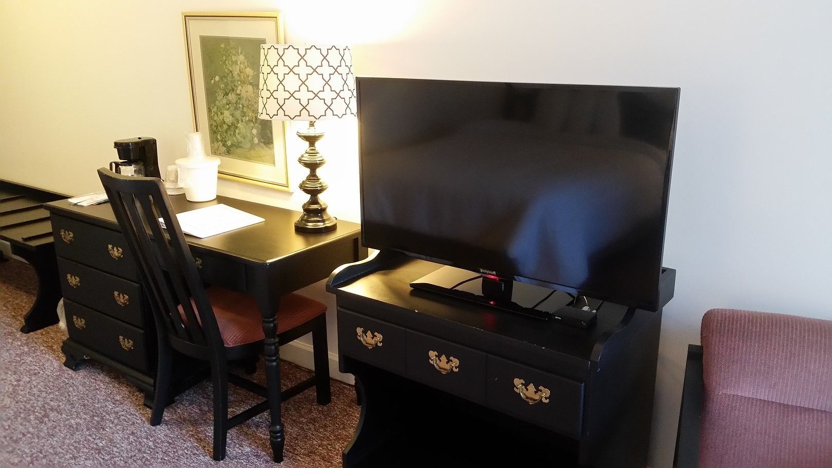 standard room, 2 queen beds (west inn) | living area | flat-screen tv