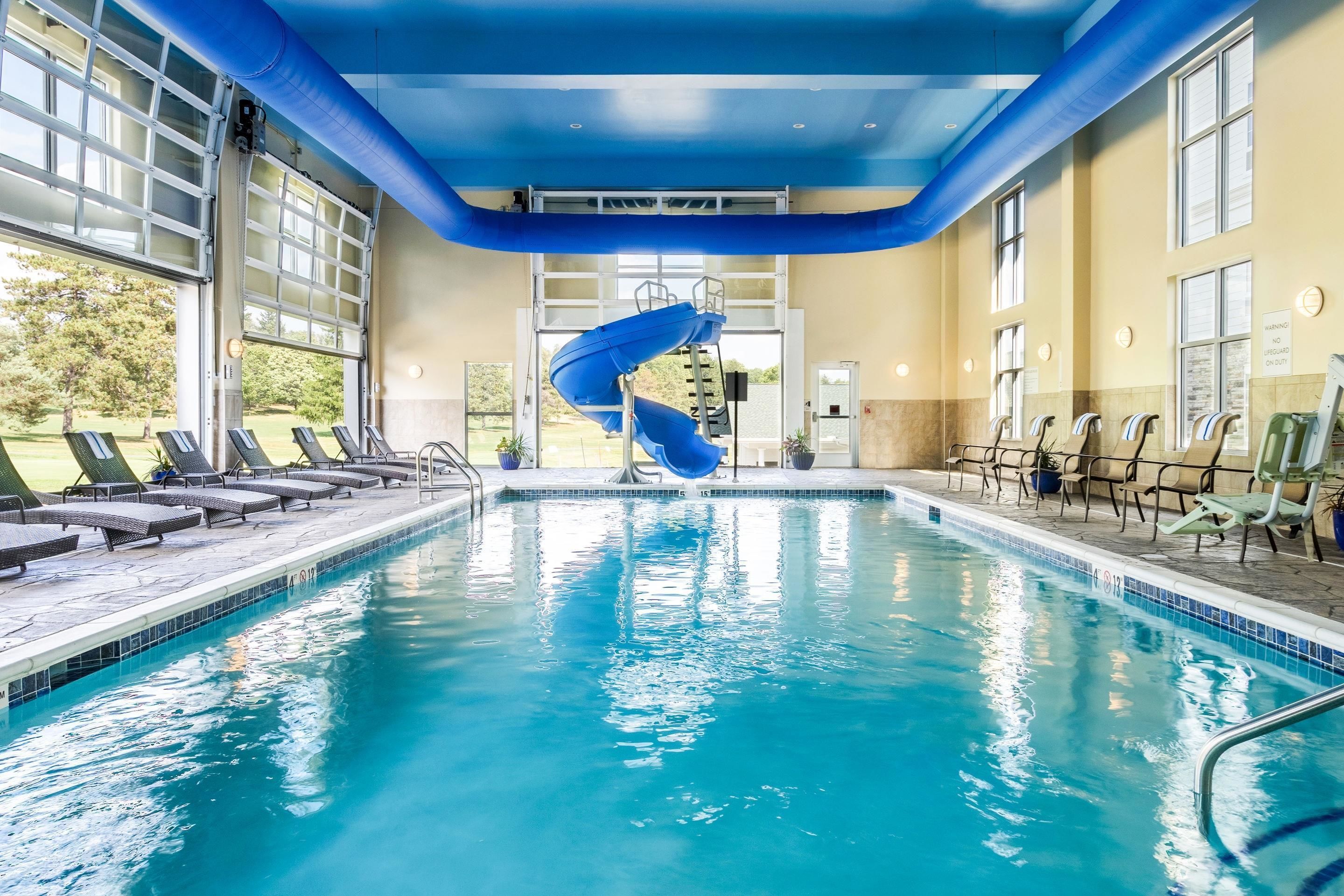 Indoor pool, open 8:00 AM to 11:00 PM, pool loungers