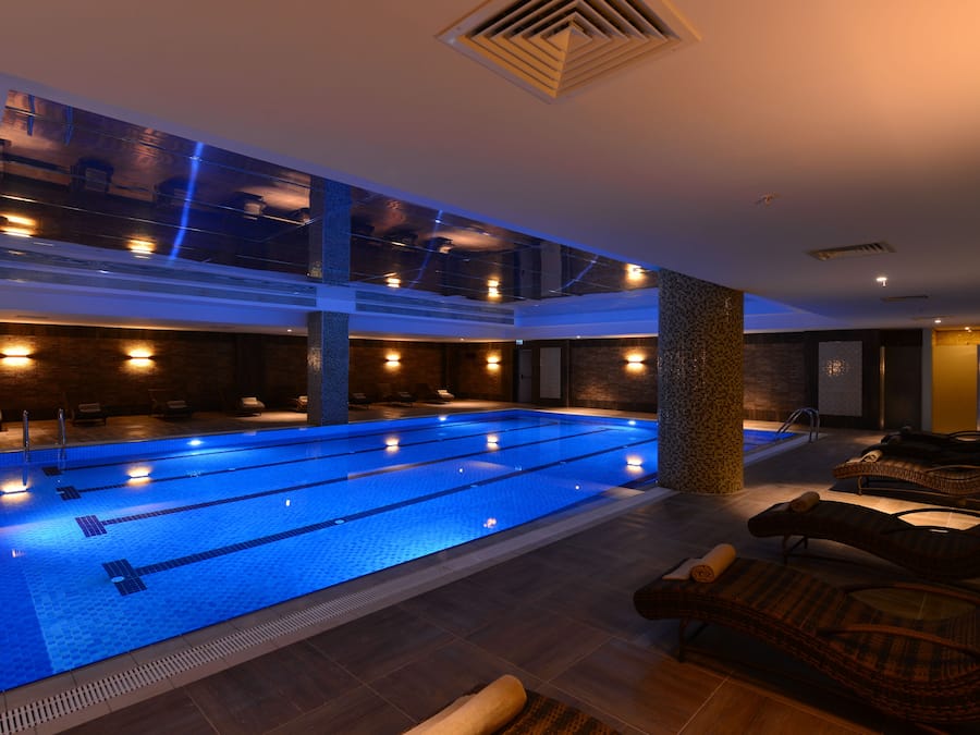 Indoor pool, open 7:00 AM to 10:00 PM, pool loungers