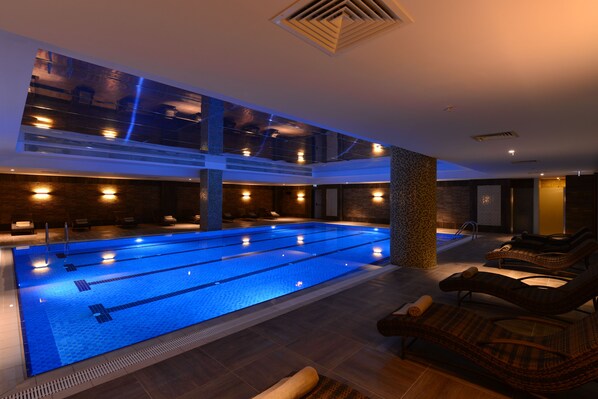 Indoor pool, open 7:00 AM to 10:00 PM, sun loungers