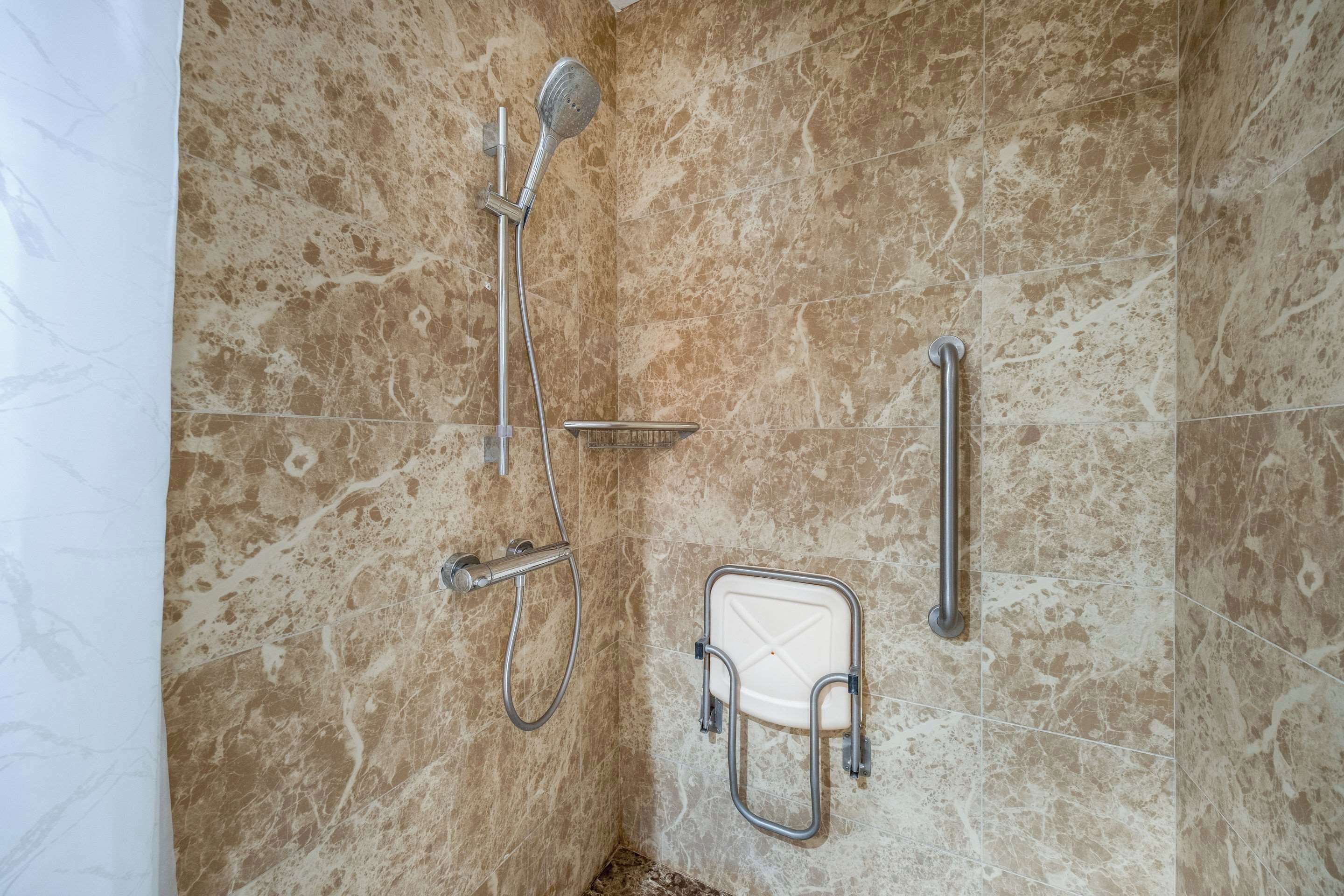 A shower area with a handheld showerhead, a handheld showerhead, a handheld showerhead, a handheld showerhead, a handheld showerhead, a handheld showerhead, a handheld showerhead, a handheld showerhead, a handheld showerhead, a handheld showerhead, a handheld showerhead, a handheld showerhead, a handheld showerhead, a handheld showerhead, a handheld showerhead, a handheld showerhead, a handheld showerhead, a handheld showerhead, a handheld showerhead, a handheld showerhead, a handheld showerhead, a handheld showerhead, a handheld showerhead, a handheld showerhead, a handheld showerhead, a handheld showerhead, a handheld showerhead, a handheld showerhead, a handheld showerhead, a handheld showerhead, a handheld showerhead, a handheld showerhead, a handheld showerhead, a handheld showerhead, a handheld showerhead, a handheld showerhead, a handheld showerhead, a handheld showerhead, a handheld shower